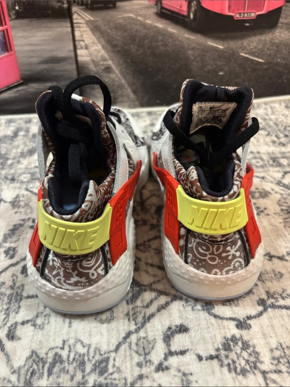 Nike Huarache Kids White Sneakers with Black Pattern, Orange & Yellow Accents